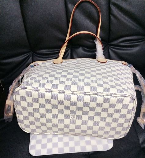 how to spot fake louis vuitton neverfull damier ebene|false louis vuitton neverfull.